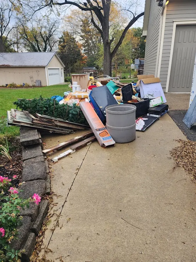 Dumpster being loaded with debris for Estate Cleanout Dumpster Rental in Ohio